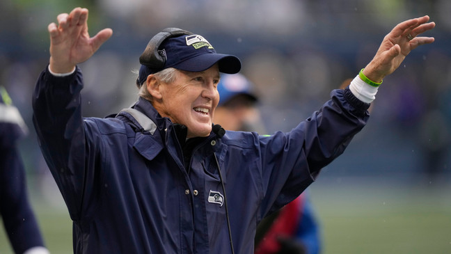 FILE - Seattle Seahawks head coach Pete Carroll celebrates after a touchdown catch by wide receiver Tyler Lockett during the second half of an NFL football game against the Los Angeles Rams Sunday, Jan. 8, 2023, in Seattle. (AP Photo/Stephen Brashear)