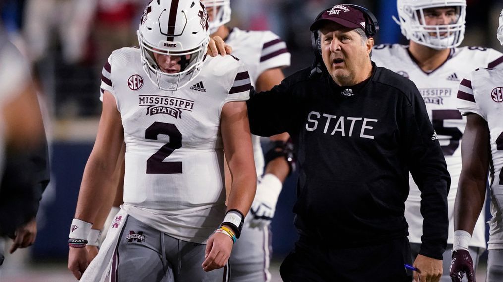 Mississippi State coach Mike Leach confers with quarterback Will Rogers (2) during the first half of the team's NCAA college football game against Mississippi in Oxford, Miss., Thursday, Nov. 24, 2022. (AP Photo/Rogelio V. Solis)