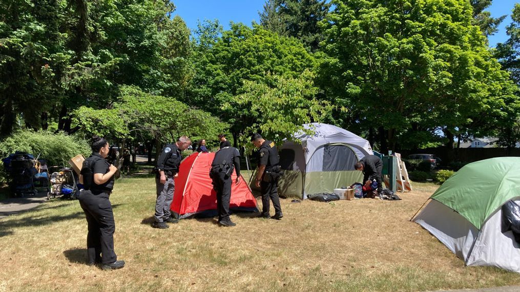 Police in Burien{&nbsp;} go tent to tent, asking people to pack up their tents and their belongings from Dottie Harper Park on Tuesday.  (KOMO News)