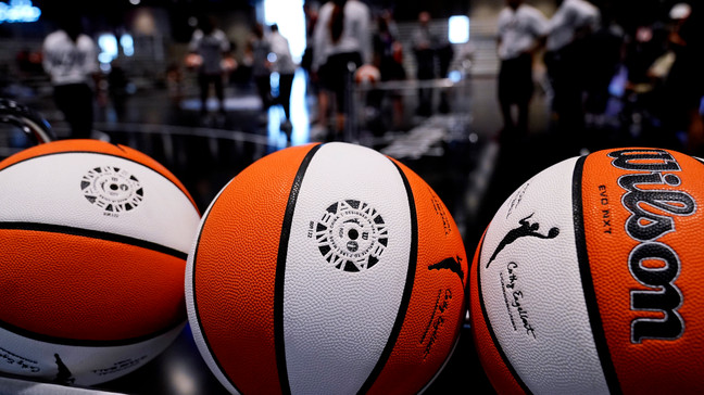 FILE - Basketballs sit in a rack during practice for the WNBA All-Star basketball game in Chicago, Saturday, July 9, 2022. Even the handful of players selected in the upcoming WNBA draft will find it difficult to continue their pro careers. There are only potentially 144 WNBA roster spots available and most of those are filled with returning players. (AP Photo/Nam Y. Huh, File)
