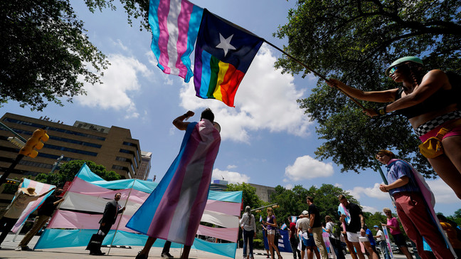 FILE - Demonstrators gather on the steps to the State Capitol to speak against transgender-related legislation bills being considered in the Texas Senate and House, May 20, 2021, in Austin, Texas. (AP Photo/Eric Gay, File)
