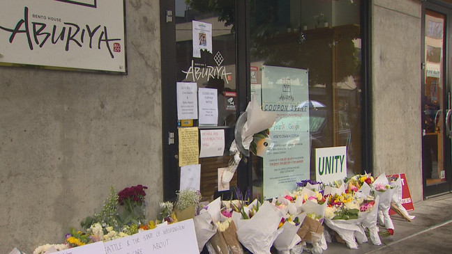 Flowers and signs line the front of Eina Kwon's restaurant as a memorial to honor the pregnant Seattle restaurant owner who was murdered in Belltown on June 13, 2023. (KOMO)