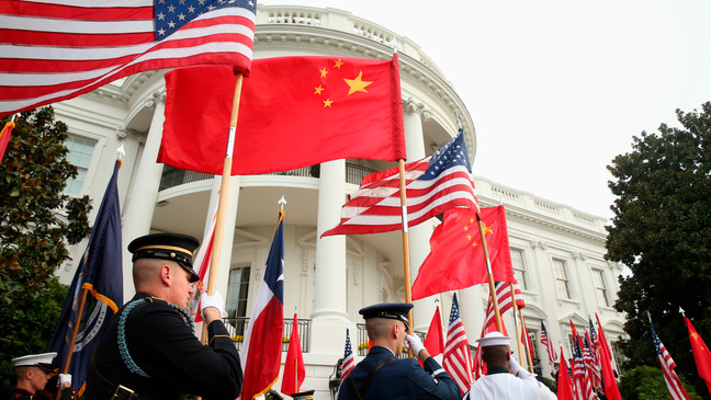 FILE - In this Sept. 25, 2015, file photo, a military honor guard await the arrival of Chinese President Xi Jinping for a state arrival ceremony at the White House in Washington. (AP Photo/Andrew Harnik, File)