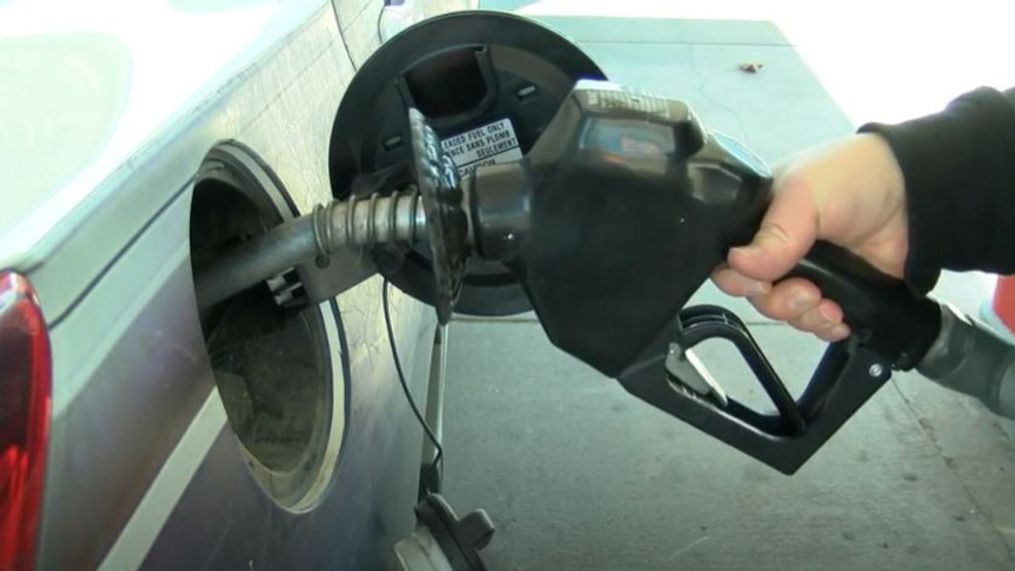 FILE – A person puts the nozzle of a gas pump in their vehicle at a gas station. (SBG image)