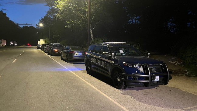 Seattle police respond to an encampment in the Highland Park neighborhood after a body was found on May 30, 2023. (KOMO News)