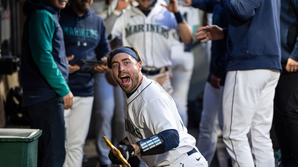 Seattle Mariners' Tom Murphy celebrates in the dugout after hitting a two-run home run off Texas Rangers starting pitcher Andrew Heaney during the seventh inning of a baseball game Tuesday, May 9, 2023, in Seattle. (AP Photo/Stephen Brashear)