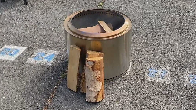 Wood sits against a smokeless fire pit. (Photo: KOMO News via Consumer Reports)