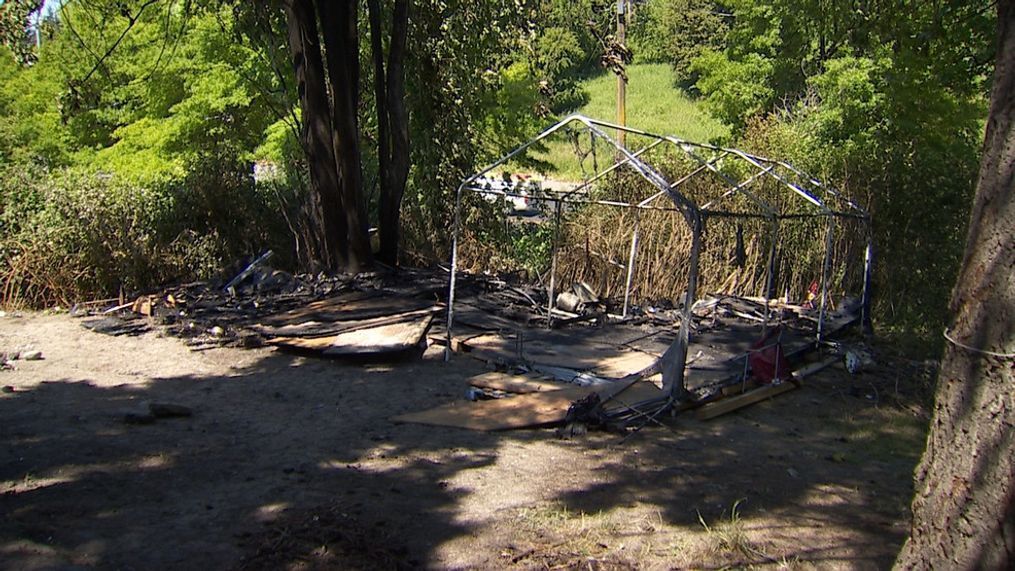 The aftermath of a large fire at an encampment near the I-5 interchange in Seattle on May 26, 2023. (KOMO)