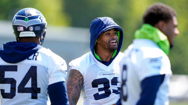 Seattle Seahawks safety Jamal Adams (33) talks with linebacker Bobby Wagner (54) during NFL football practice, Tuesday, June 6, 2023, at the team's facilities in Renton, Wash. (AP Photo/Lindsey Wasson)