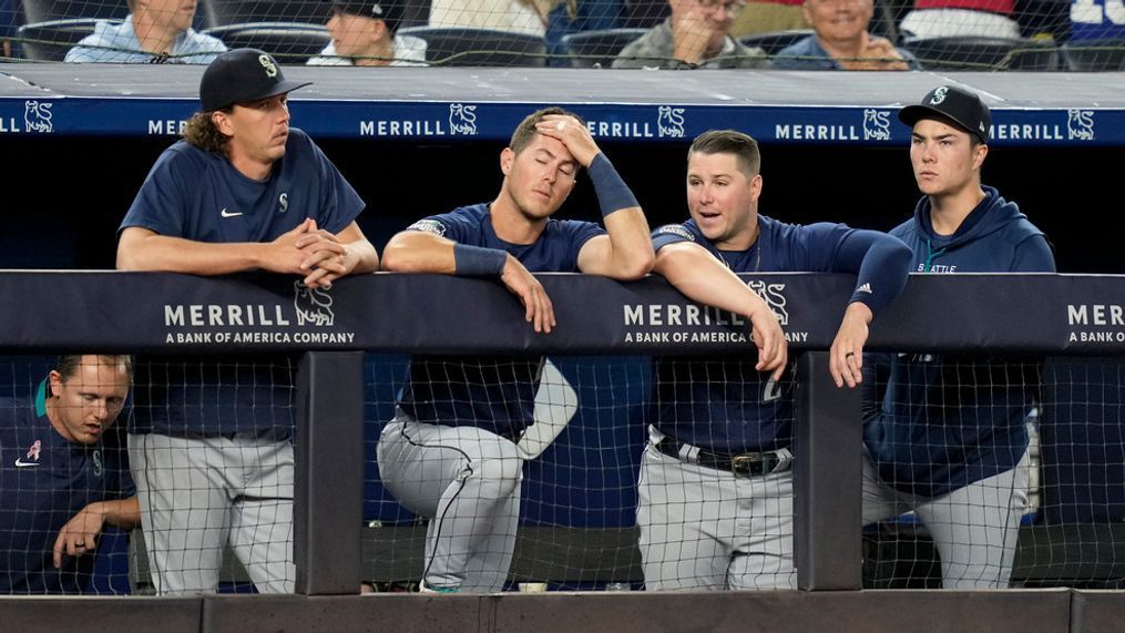 Players in the Seattle Mariners dugout react as they trail the New York Yankees by two runs in the ninth inning of a baseball game, Tuesday, June 20, 2023, in New York. (AP Photo/John Minchillo)