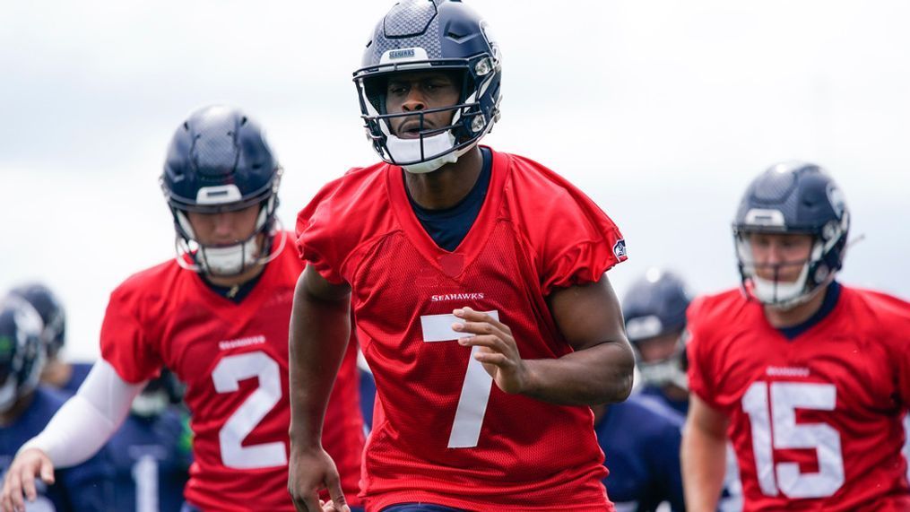 Seattle Seahawks quarterback Geno Smith (7) runs drills with fellow quarterbacks Drew Lock (2) and Holton Ahlers (15), Monday, May 22, 2023, at the team's NFL training facility in Renton, Wash. (AP Photo/Lindsey Wasson)