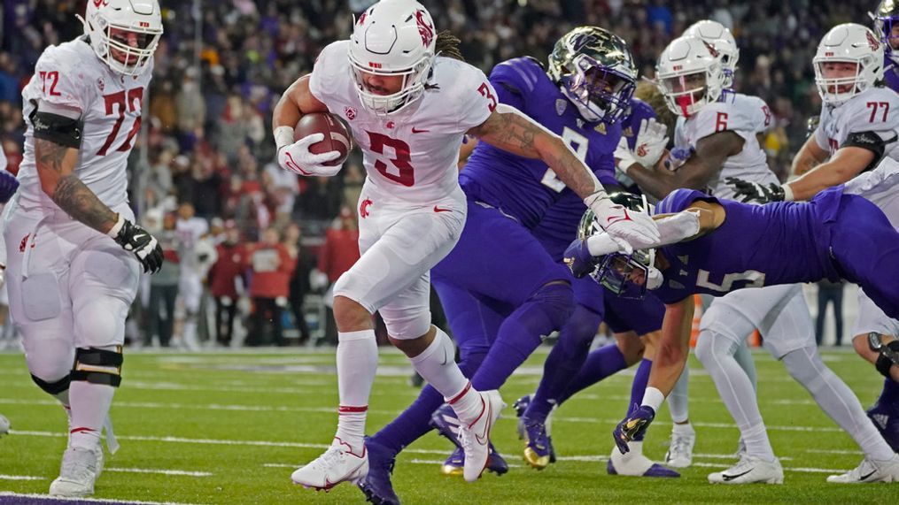 Washington State running back Deon McIntosh (3) scores a touchdown against Washington during the second half of an NCAA college football game, Friday, Nov. 26, 2021, in Seattle. (AP Photo/Ted S. Warren)