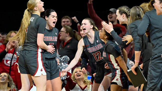 Washington State celebrates a 3-point basket by guard Charlisse Leger-Walker, second from left, during the second half of an NCAA college basketball game against UCLA in the finals of the Pac-12 women's tournament Sunday, March 5, 2023, in Las Vegas. (AP Photo/David Becker)