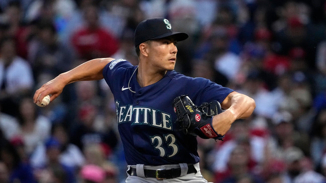 Seattle Mariners starting pitcher Bryan Woo throws to the plate during the first inning of a baseball game against the Los Angeles Angels Saturday, June 10, 2023, in Anaheim, Calif. (AP Photo/Mark J. Terrill)
