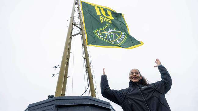 Former professional basketball player Sue Bird poses for members of the media after she raised a replica of her jersey retirement banner on top of the Space Needle in Seattle, Wash., Friday, June 9, 2023. The Seattle Storm will honor Bird when they retire her number during a ceremony Sunday, June 11.  (Daniel Kim/The Seattle Times via AP)