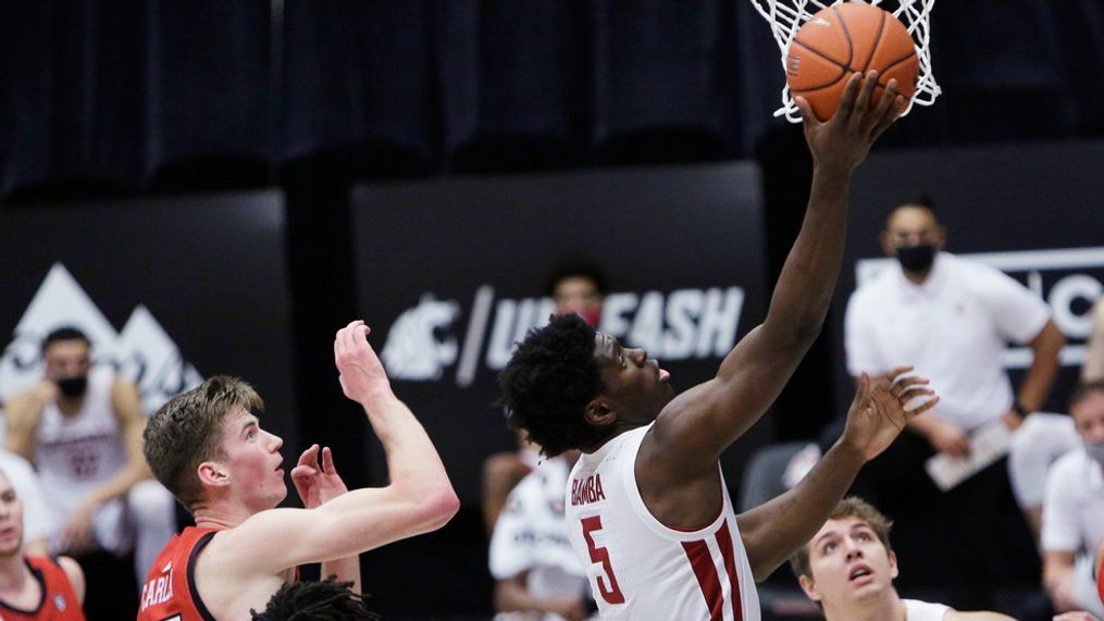 Washington State guard TJ Bamba (5) shoots in front of Utah center Branden Carlson (35) during the second half of an NCAA college basketball game in Pullman, Wash., Thursday, Jan. 21, 2021. (AP Photo/Young Kwak)