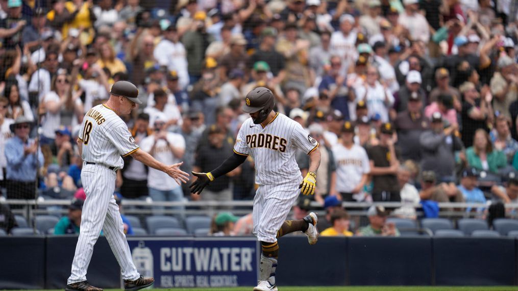 San Diego Padres' Gary Sanchez, right, celebrates with third base coach Matt Williams after hitting a three-run home run during the third inning of a baseball game against the Seattle Mariners, Wednesday, June 7, 2023, in San Diego. (AP Photo/Gregory Bull)