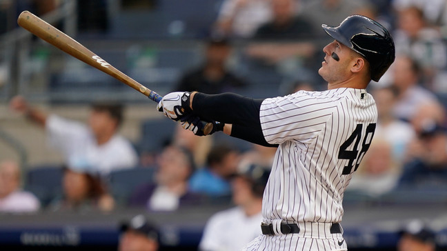 New York Yankees' Anthony Rizzo hits an RBI double off Seattle Mariners starting pitcher George Kirby in the first inning of a baseball game, Tuesday, June 20, 2023, in New York. (AP Photo/John Minchillo)