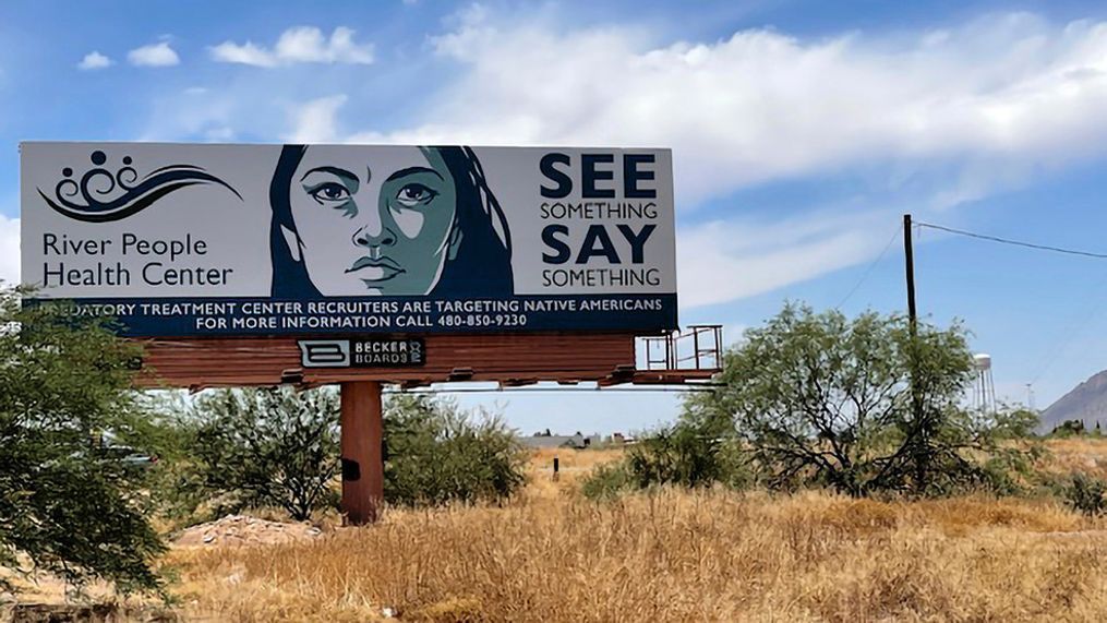 A billboard is seen in Scottsdale, Ariz., Saturday, June 10, 2023, near the health care facility of the Salt River Pima-Maricopa Indian Community, which has been affected by a gigantic Medicaid fraud scheme involving sober living homes that promised help to Native Americans seeking to kick alcohol and other additions. Navajo National Attorney General Ethel Branch said Monday, June 12, 2023, that Navajo law enforcement teams that fanned out over metro Phoenix in recent weeks made contact with several hundred Native Americans from various tribes on the streets amid the state crackdown. (AP Photo/Anita Snow)