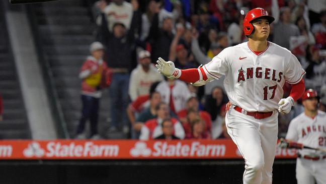 Los Angeles Angels' Shohei Ohtani tosses his bat after hitting a two-run home run during the third inning of a baseball game against the Seattle Mariners Saturday, June 10, 2023, in Anaheim, Calif. (AP Photo/Mark J. Terrill)