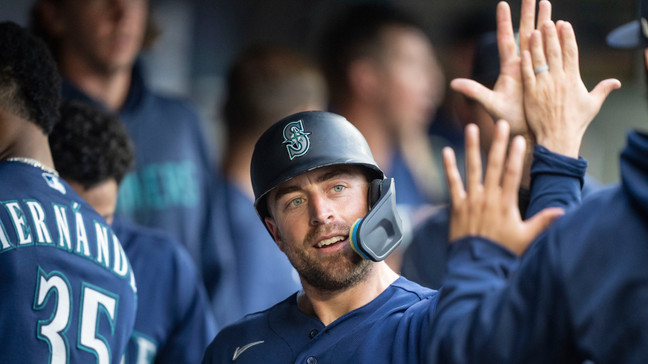 Seattle Mariners' Tom Murphy celebrates in the dugout after scoring a run on a hit by Julio Rodriguez during the second inning of a baseball game against the Miami Marlins, Monday, June 12, 2023, in Seattle. (AP Photo/Stephen Brashear)