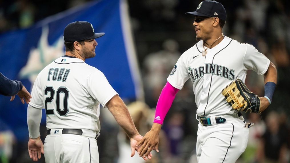 Seattle Mariners' Mike Ford, left, and Julio Rodriguez celebrate the team's win in a baseball game against the Miami Marlins, Tuesday, June 13, 2023, in Seattle. (AP Photo/Stephen Brashear)