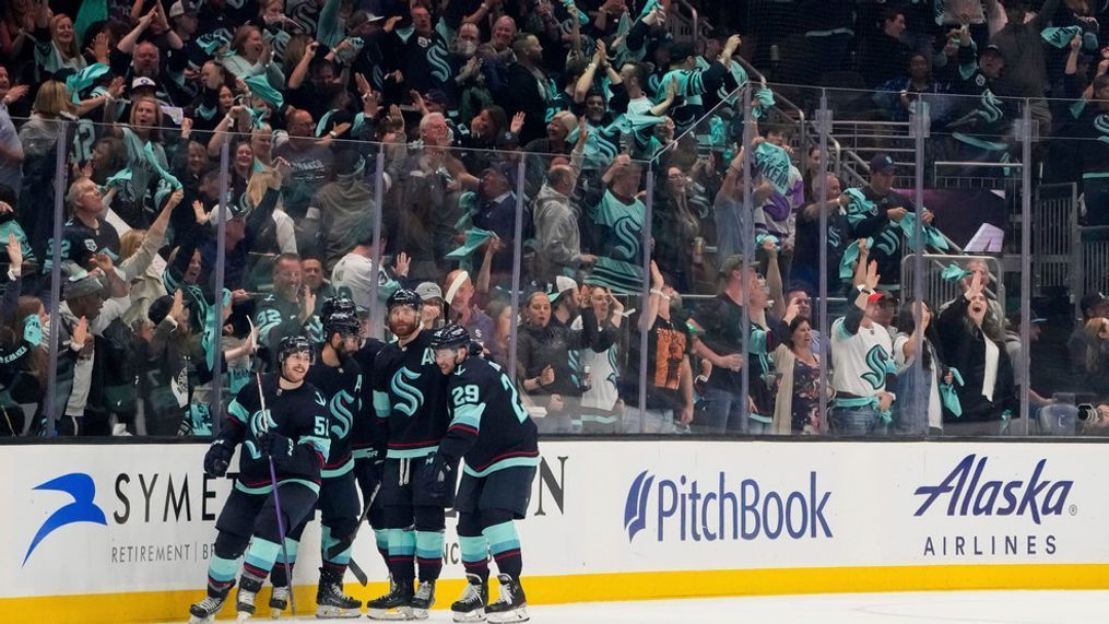 Seattle Kraken left wing Tye Kartye (52) celebrates his goal against the Dallas Stars with teammates Jordan Eberle, second from left, Adam Larsson, and Vince Dunn (29) during the second period of Game 6 of an NHL hockey Stanley Cup second-round playoff series Saturday, May 13, 2023, in Seattle. (AP Photo/Lindsey Wasson)